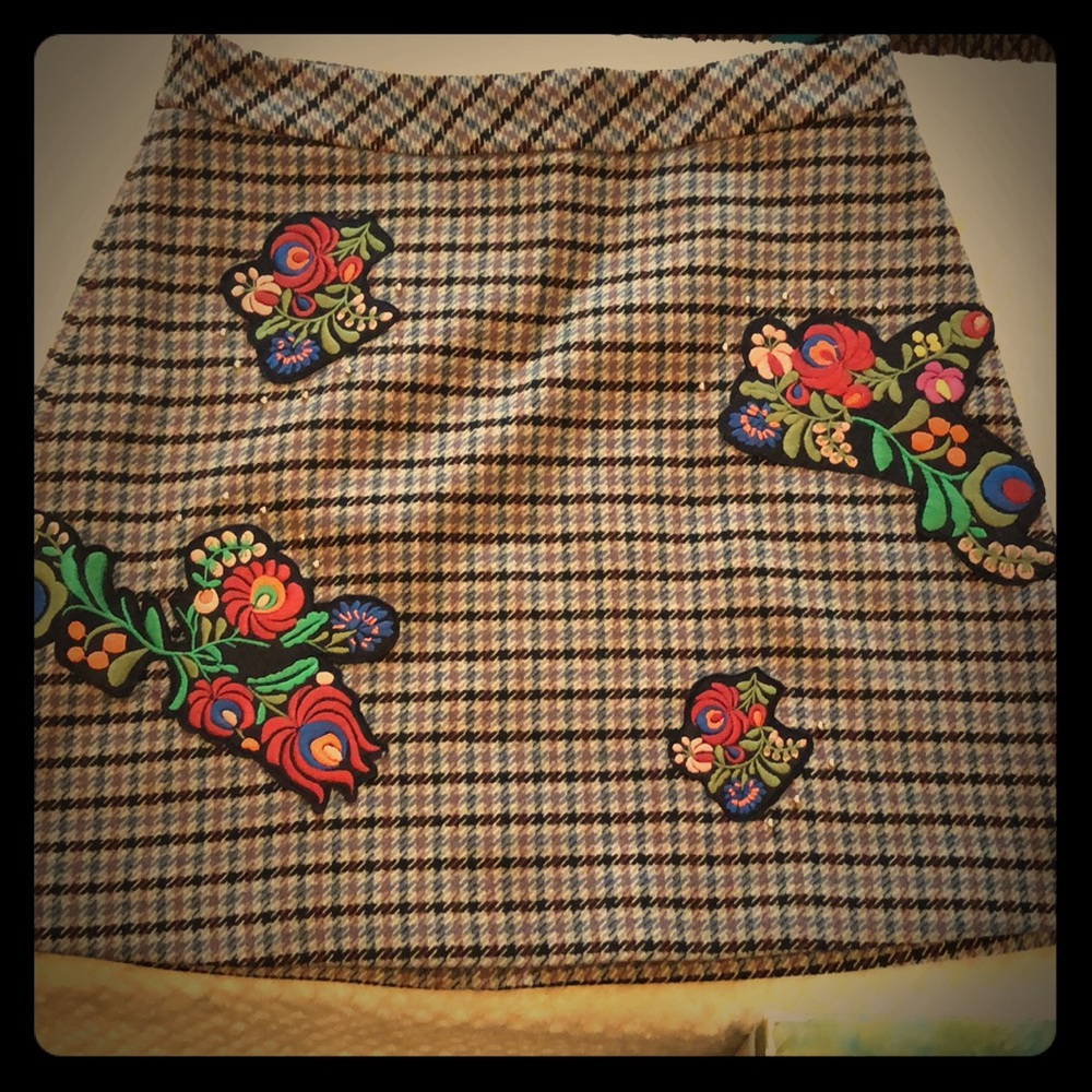 Zara-plaid skirt with floral patches.